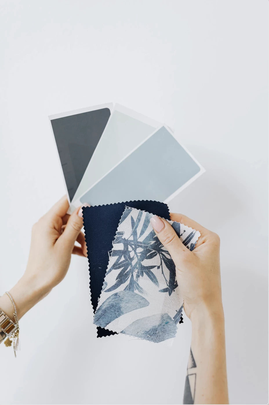 Paint swatch samples and matching fabrics and patterns selected by a designer